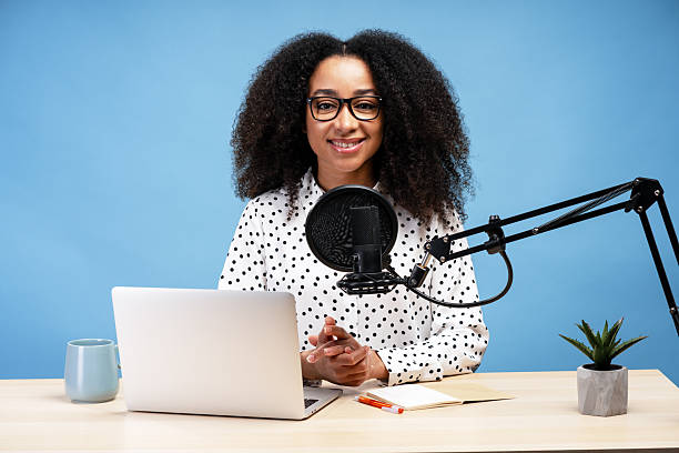 istock African American content creator recording a podcast using laptop and microphone 2225273870