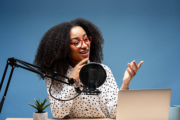istock Young woman recording a podcast from her home studio 2225273874