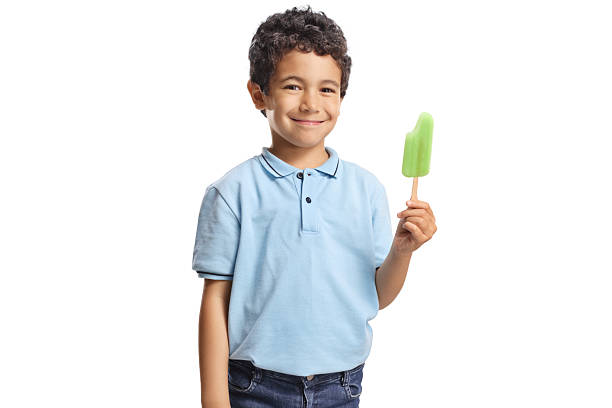 istock Kid holding ice cream lollie and smiling 2225273995