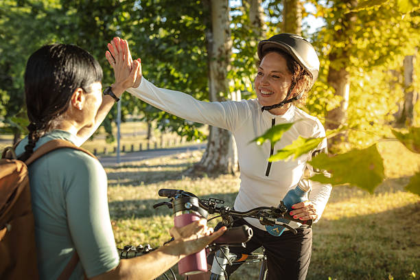 istock Two women celebrating after cycling outdoors on a sunny day 2225276011