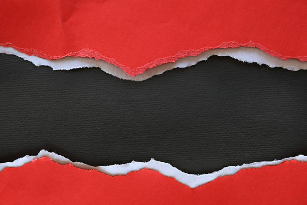 istock Ripped red paper on black 2225279141