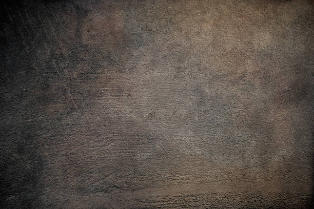 Aged concrete wall with cement stucco texture for background design.