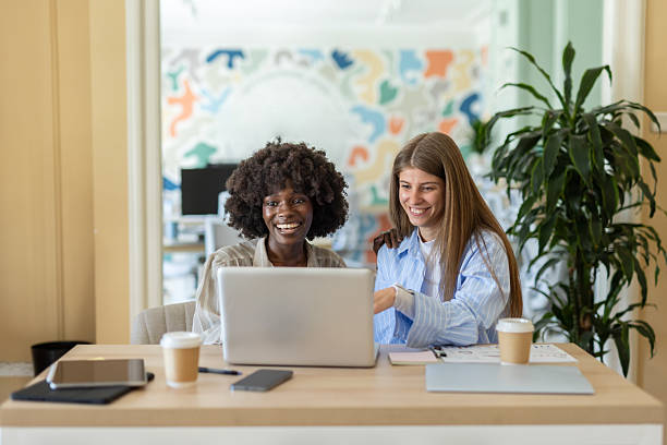 istock Joyful teamwork in a stylish office space over laptop. 2225282621