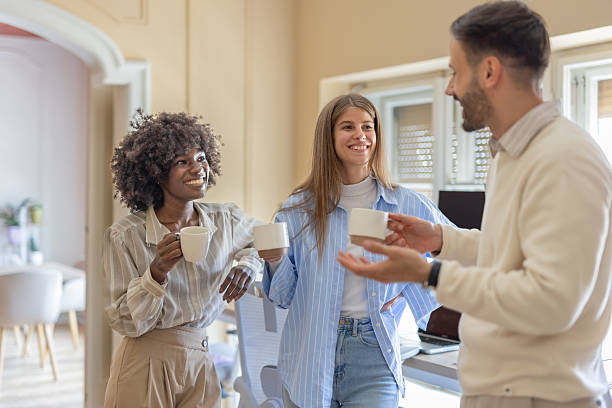 istock Colleagues enjoying a coffee break in inviting workspace 2225282635