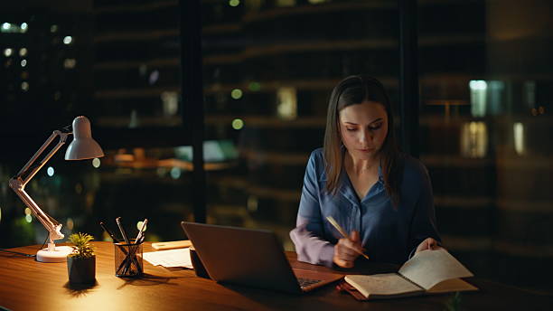 istock Manager planning project late evening in modern office. Hardworking freelancer 2225288088