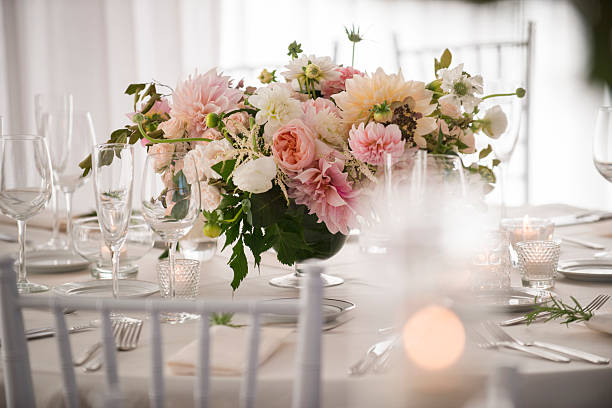 istock Low Floral Centerpiece with Candles on Elegant Wedding Table 2225291182