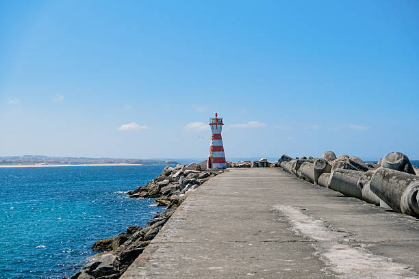 Jetty with a lighthouse. Peniche pier in Portugal in Peniche, Leiria District, Portugal