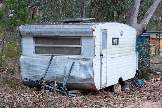 istock An old and destroyed caravan abandoned in a forest 2225298590