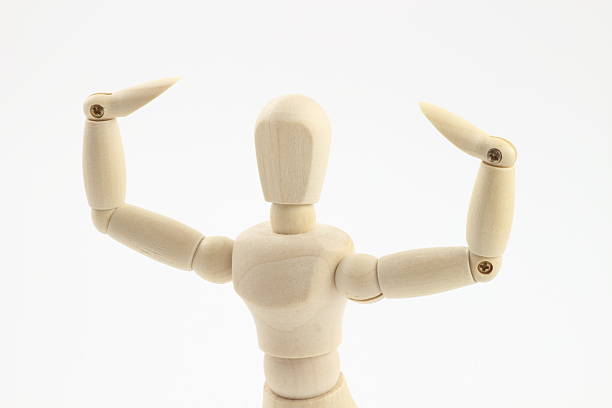 istock Wooden Mannequin's Biceps, Standing Out Against White. 2225301481