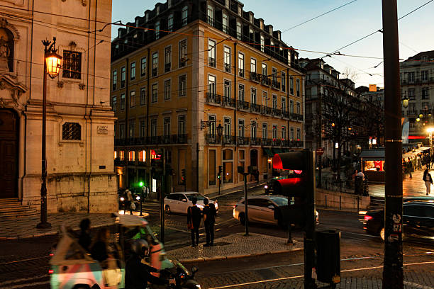 The streets of the Chiado district lit up during the night.