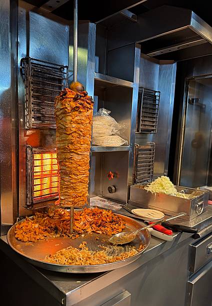 istock Doner kebab or chicken shawarma preparation in restaurant 2225302193