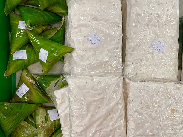 istock Freshly made Indonesian tempeh in both traditional banana leaf and modern vacuum packaging. 2225302375