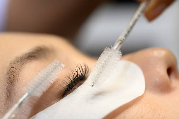 istock Macro shot of lash technician brushing eyelash extensions with brushes 2225302994