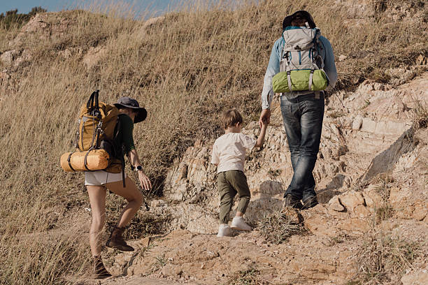 istock Parents are taking their son for a walk along the seaside to study nature resources. 2225303167