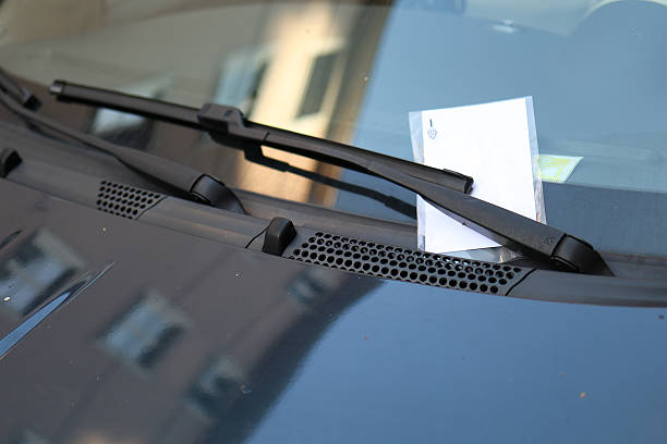 istock paper with a fine stuffed behind the car's windshield wipers 2225303367