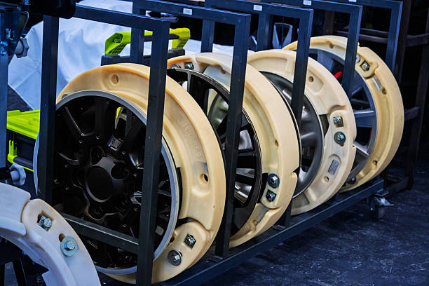 istock Multiple run-flat tire inserts fitted within car wheel rims, stored on a rack, showcasing innovative automotive safety technology in production or display. 2225306455