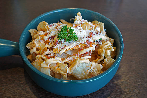 Close up crispy Nachos with cheese and bacon