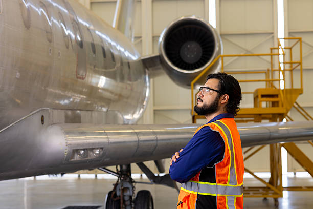 istock Tech man inspecting the outside of the plane's fuselage. 2225309250