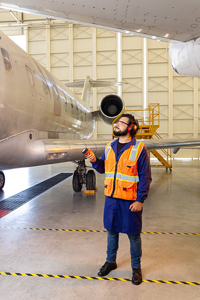 istock Tech man inspecting the outside of the plane's fuselage. 2225309310