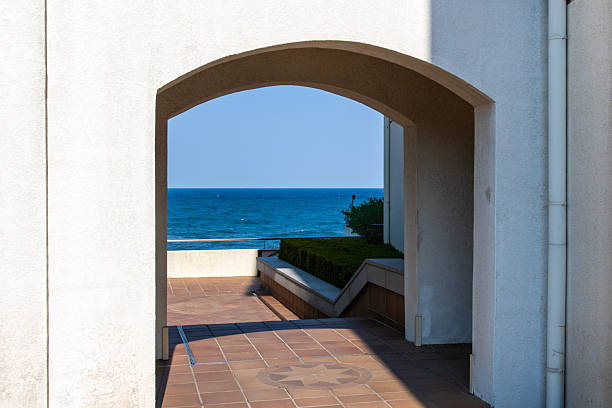 Surrealistic window open on calm ocean, window to freedom