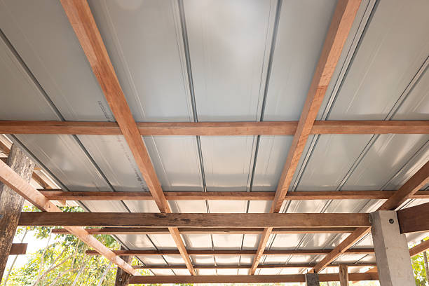 istock Roof under construction with metal sheet and wood structure. 2225309570