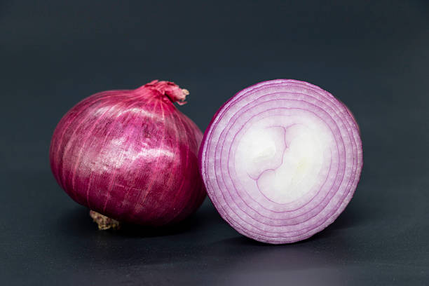istock Fresh whole and slice Onion, isolated on black background.. 2225309701