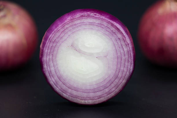 istock Onion, isolated on black background, round shape cut onion 2225310123