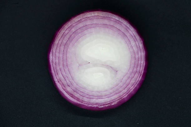istock Slice of Onion, isolated on black background. 2225310673