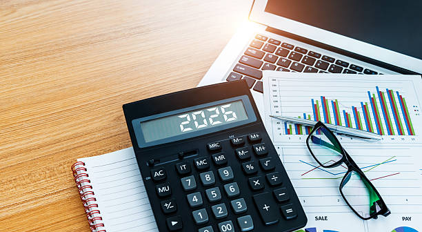 istock New year number 2026 on the calculator screen,  at financial analysis desk 2225310821