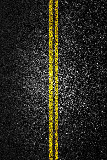 istock Double yellow line on asphalt road 2225310953