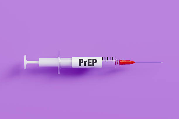 istock Prep Written Syringe On Purple Background - HIV Prevention Concept 2225311004
