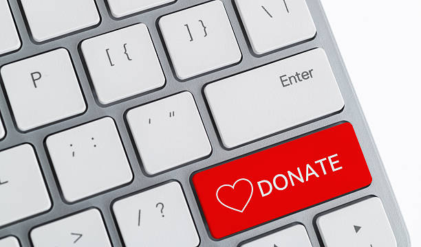 istock Computer keyboard with word donate and heart icon 2225311029