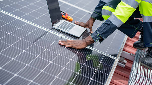 istock Service engineer checking solar cell on the roof for maintenance if there is a damaged part. Engineer worker install solar panel. Clean energy concept. 2225311903