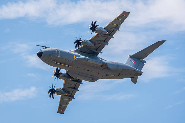 Dugny, France - June 20, 2025: A French Air and Space Force Airbus A400M Atlas, the European four-engine military transport aircraft, in flight over Paris-Le Bourget airport.