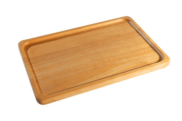 istock Top view of a rectangular light wood cutting board with juice groove, isolated on white for kitchen, cooking, or food prep themes 2225315969