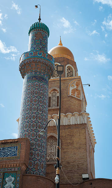 istock Historic mosque tower in Kufa Iraq under a clear blue sky 2225317755