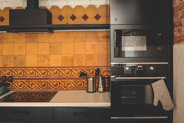 Modern light kitchen with island and stools. Nobody inside