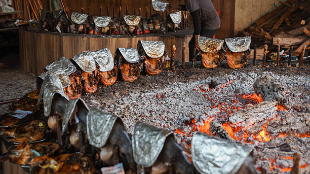 istock Masgouf fish grilling process in Iraq over an open flame at local restaurant 2225318451