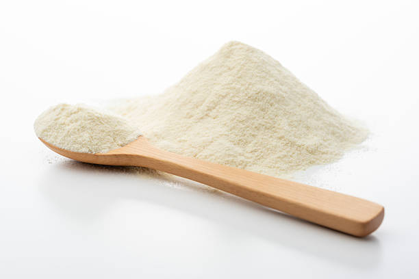 istock Protein powder in wooden spoon on white background 2225319895
