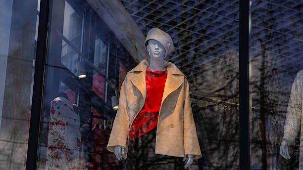 istock A modern boutique showcases elegant outerwear on mannequins in a large window The setting highlights afternoon light and urban surroundings attracting potential customers 2225319904