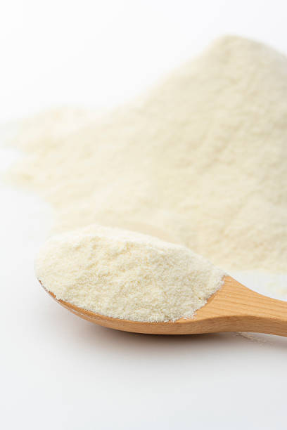 istock Protein powder in wooden spoon on white background 2225319935