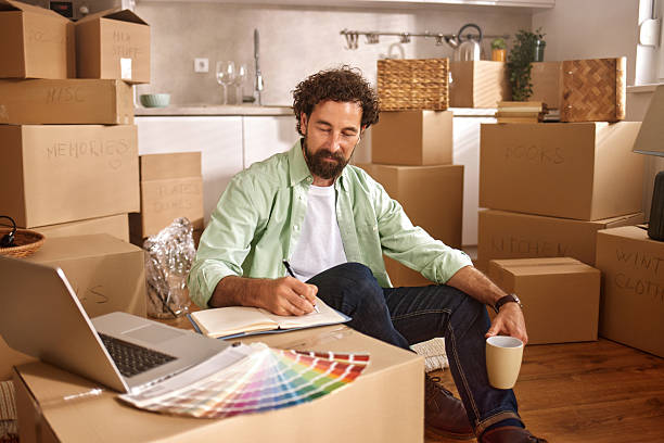 istock Man planning renovation of new home while having coffee 2225320016