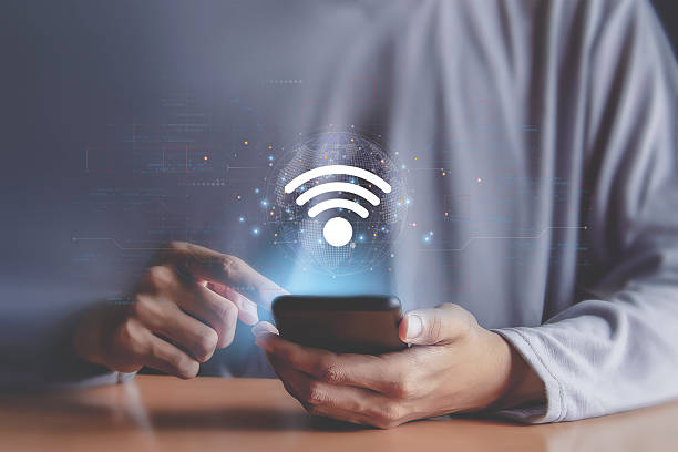 istock Businessman using smartphone with wifi icon, business communication social network concept 2225320474