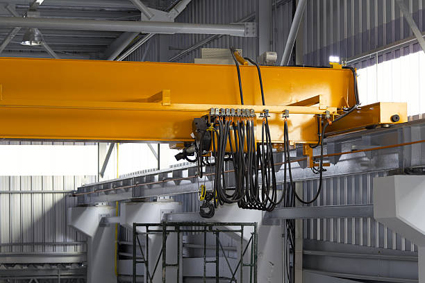 istock Overhead crane or lifting equipment inside factory or warehouse. 2225321148