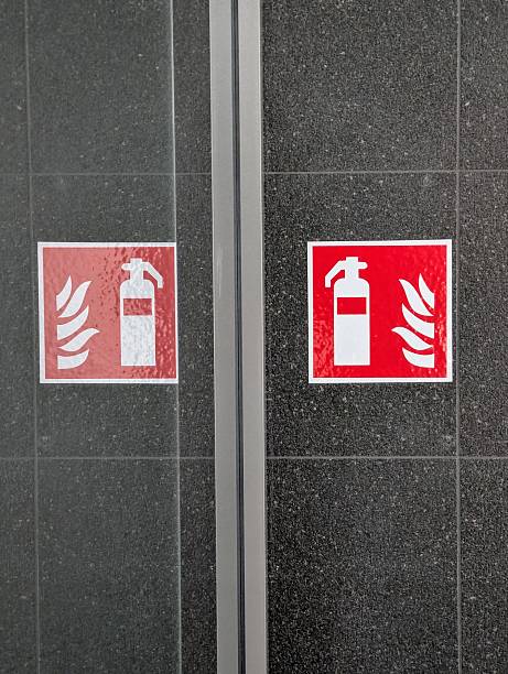 istock Fire Extinguisher Sign with reflection on glass wall 2225321294