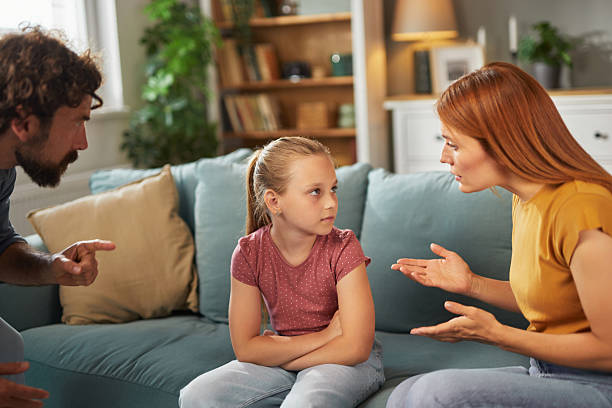 istock Parents scolding daughter at home after misbehavior 2225321334