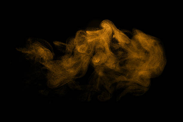 istock gold smoke on a black background, brown dust to blow 2225323135