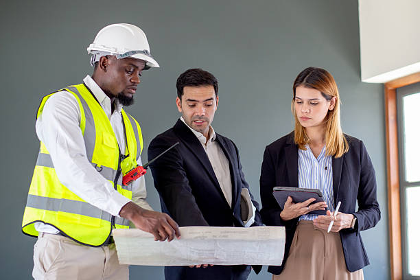 istock Group engineer team meeting discussing and planning for design with interior designer about project in construction site, architect team development and examining blueprint, industrial and worker. 2225325573
