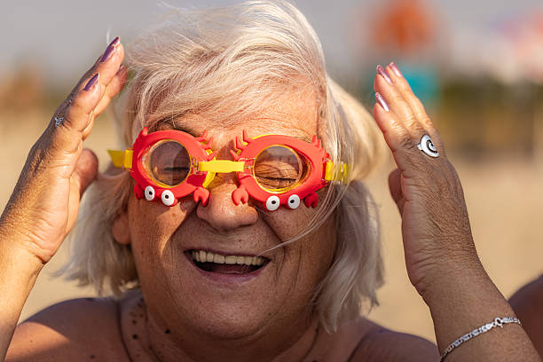 istock Sun, Sea, and Smiles: Grandma's Goofy Style 2225328106