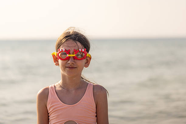 baby on the beach smiling and playing